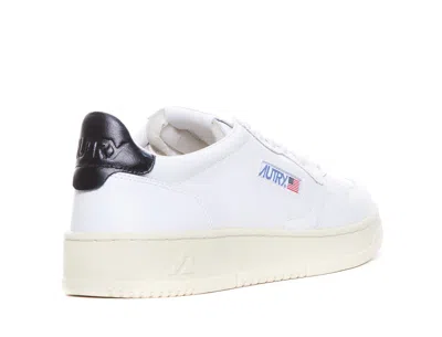 Shop Autry Sneakers In White