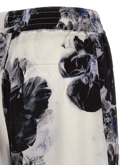 Shop Alexander Mcqueen Floral Trousers In Blue