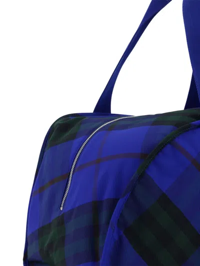 Shop Burberry Travel Bags In Blue
