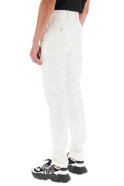 Shop Dolce & Gabbana Glossy Nylon Trousers In 白色的