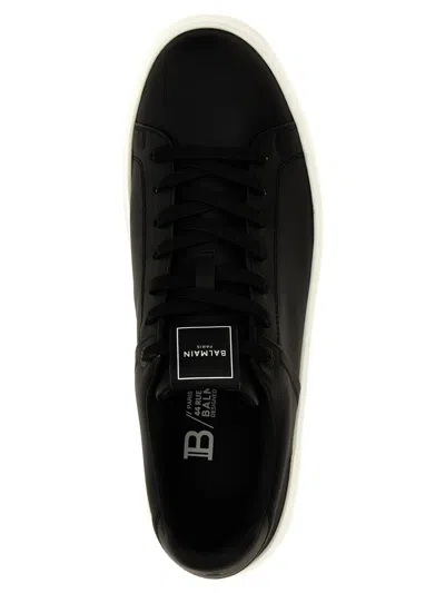 Shop Balmain 'b-court' Sneakers In White/black