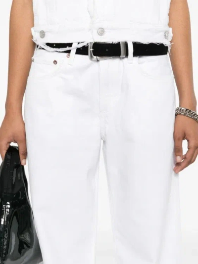 Shop Agolde Clara Low-rise Flared Jeans In White