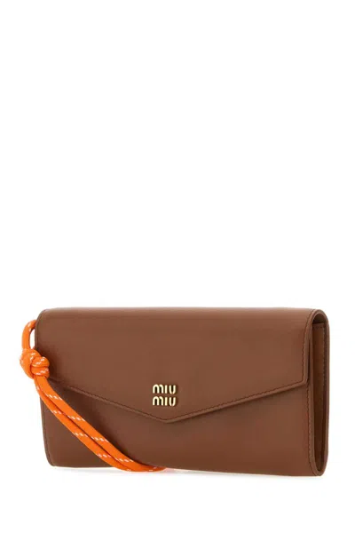 Shop Miu Miu Wallets In Brown