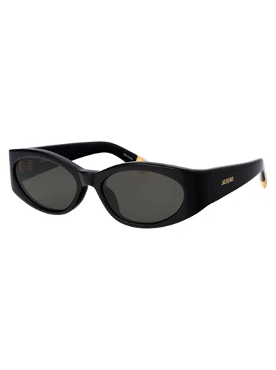 Shop Jacquemus Ovalo Sunglasses In 01 Black/ Yellow Gold/ Grey
