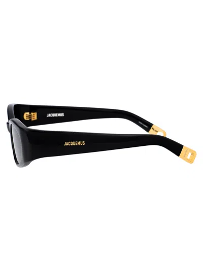 Shop Jacquemus Ovalo Sunglasses In 01 Black/ Yellow Gold/ Grey