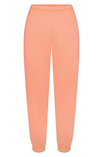Shop Skims Chase Sport French Terry Joggers In Neon Orange