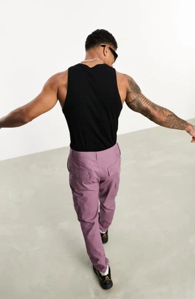 Shop Asos Design Tapered Cargo Trousers In Purple