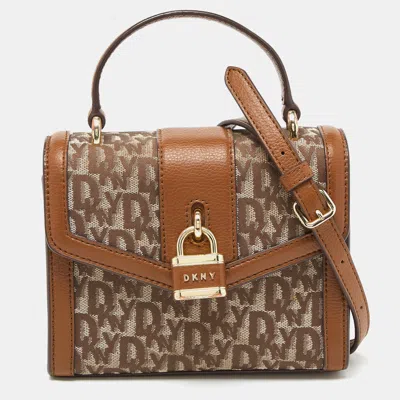 Shop Dkny /brown Signature Canvas And Leather Padlock Charm Top Handle Bag In Beige