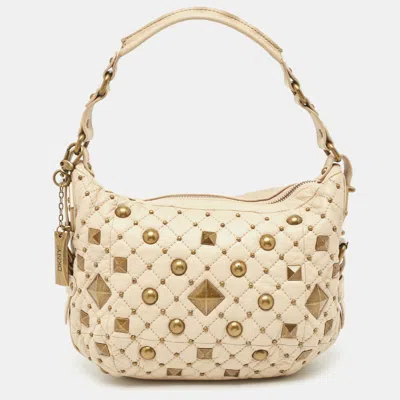 Shop Dkny Quilted Leather Studded Hobo In Beige