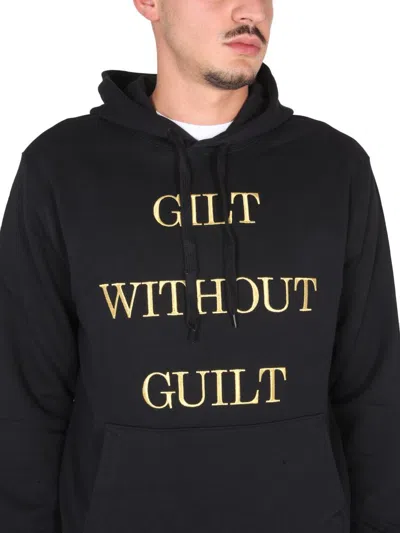 Shop Moschino "guilt Without Guilt" Sweatshirt In Black