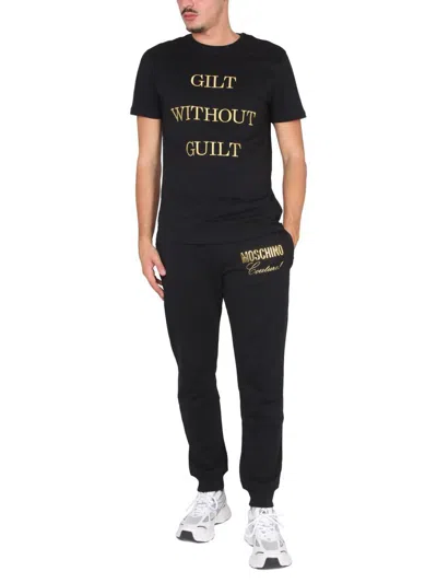 Shop Moschino "guilt Without Guilt" T-shirt In Black