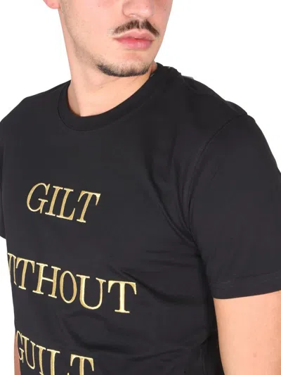 Shop Moschino "guilt Without Guilt" T-shirt In Black