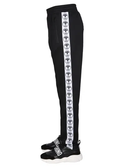 Shop Moschino Jogging Pants In Black