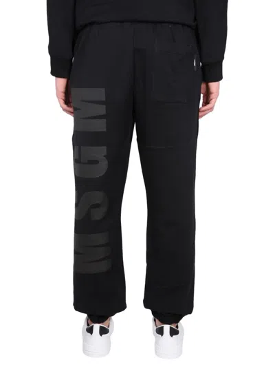 Shop Msgm Jogging Pants With Maxi Logo In Black