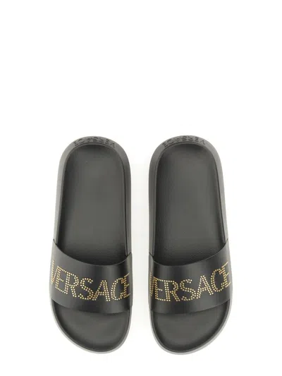 Shop Versace Sandal With Logo In Black