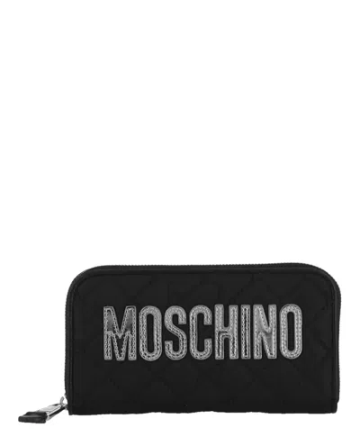 Shop Moschino Quilted Logo Zip-around Wallet In Black