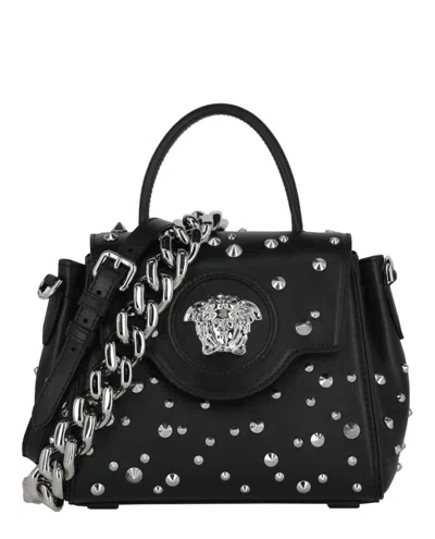 Shop Versace Studded La Medusa Shoulder Bag In Black
