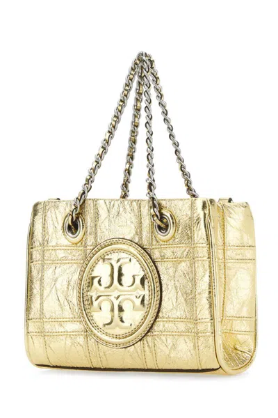 Shop Tory Burch Handbags. In Gold