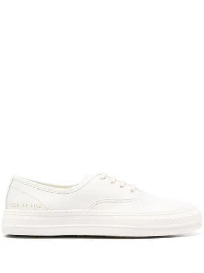 Shop Common Projects Four Hole Suede Sneakers In White