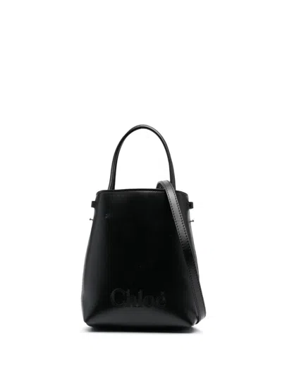 Shop Chloé Sense Micro Leather Bucket Bag In Black