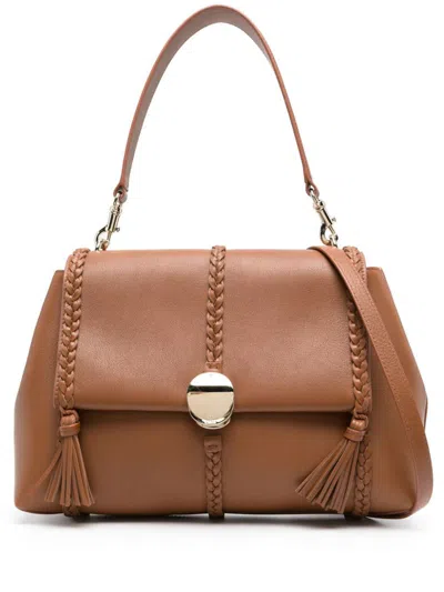 Shop Chloé Penelope Leather Shoulder Bag In Brown
