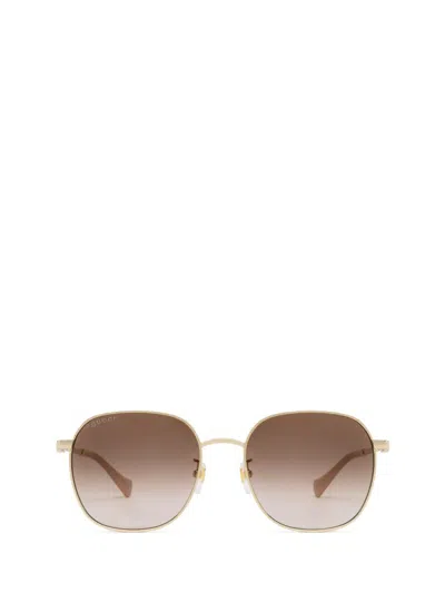 Shop Gucci Eyewear Sunglasses In Gold