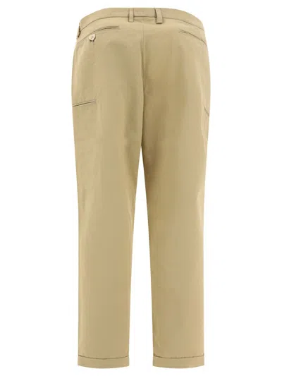 Shop Human Made Chino Trousers With Embroidered Logo In Beige