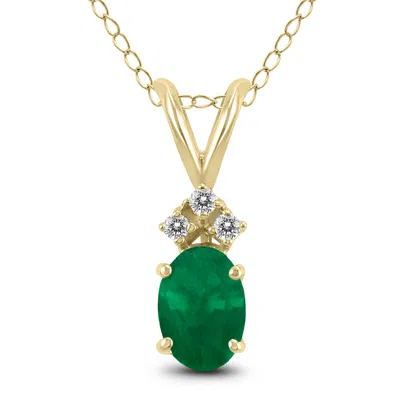 Shop Sselects 14k 5x3mm Oval Emerald And Three Stone Diamond Pendant In Green
