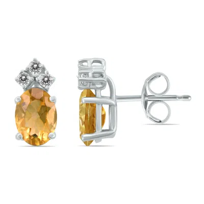 Shop Sselects 14k 6x4mm Oval Citrine And Three Stone Diamond Earrings In Orange