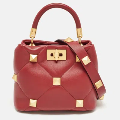 Shop Valentino Leather Small Roman Stud Top Handle Bag In Red