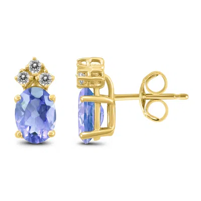 Shop Sselects 14k 5x3mm Oval Tanzanite And Three Stone Diamond Earrings In Blue