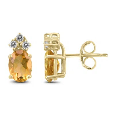 Shop Sselects 14k 7x5mm Oval Citrine And Three Stone Diamond Earrings In Orange