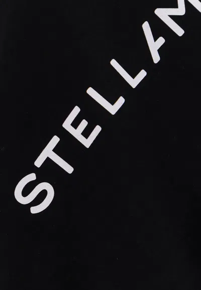 Shop Stella Mccartney Asymmetric Logo Print Crewneck Top In Black