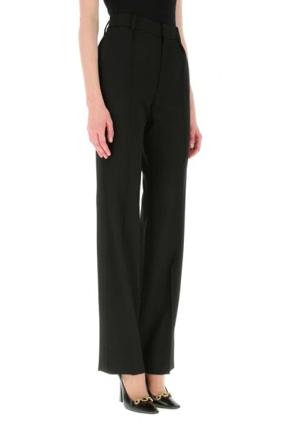 Saint Laurent Flared Tailored Wool Trousers In Black