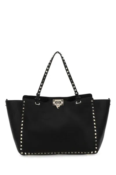 Shop Valentino Garavani Handbags. In Black