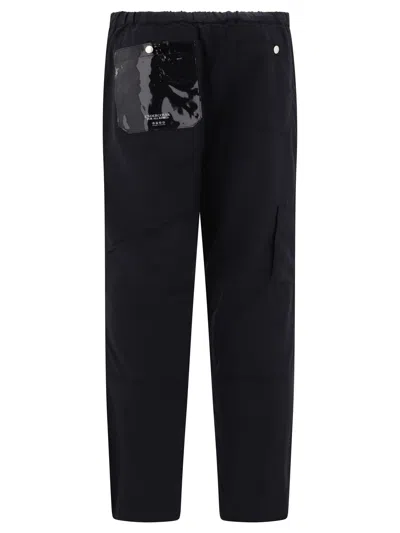 Shop Undercover Nylon Cargo Trousers In Black