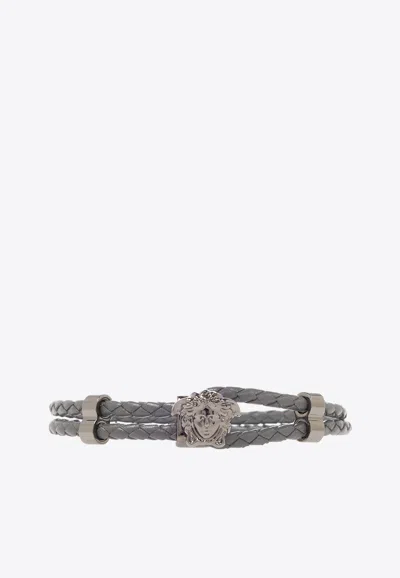 Shop Versace Braided Leather Medusa Bracelet In Gray