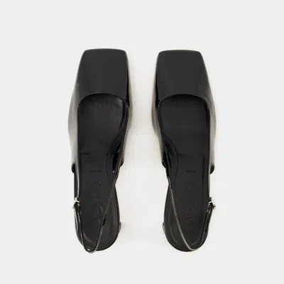 Shop Aeyde Sandals In Black