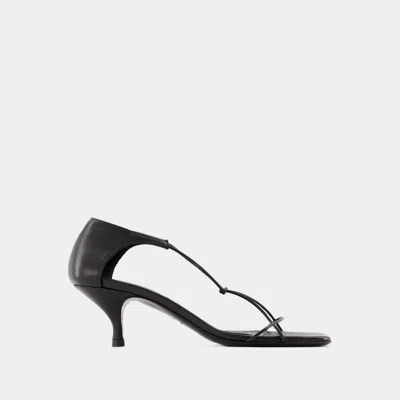 Shop Totême Sandals In Black