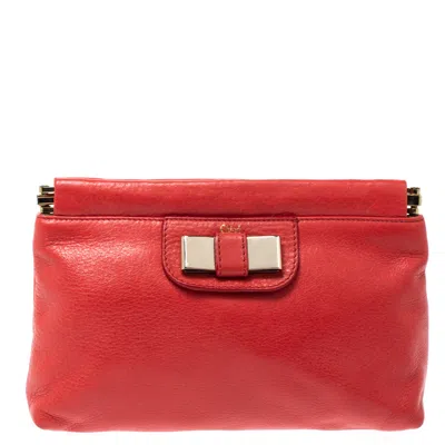 Shop Chloé Coral Leather Bow Clutch In Red