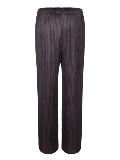Shop Issey Miyake Trousers In Black