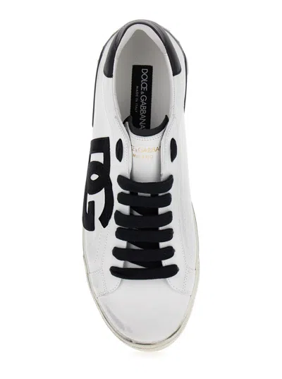 Shop Dolce & Gabbana 'portofino' White And Black Low Top Sneakers With Logo Patch And Used Effect In Leather Man In White/black