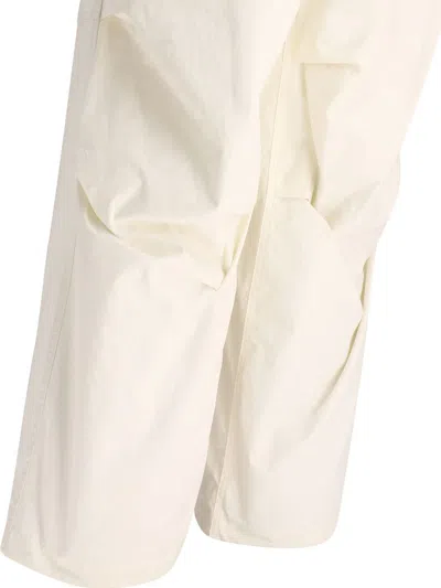 Shop Jil Sander Trousers With Knee Plea In White