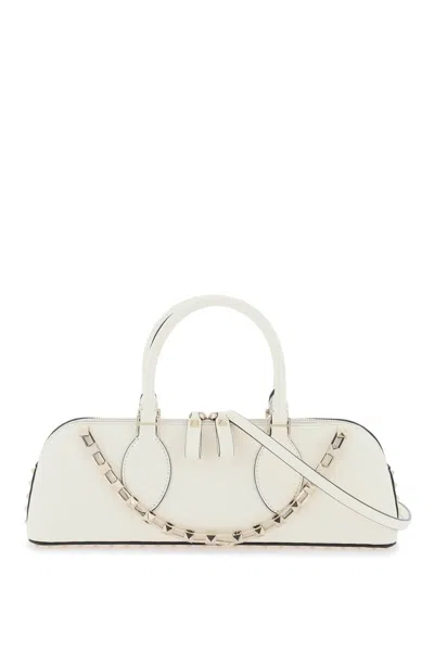 Shop Valentino Garavani Rockstud E/w Leather Handbag Women In Cream