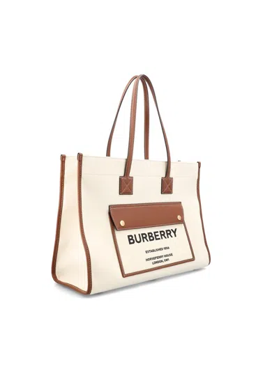Shop Burberry Handbags In Natural/malt Brown