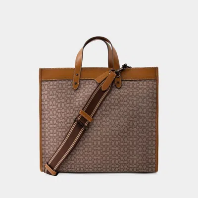 Shop Coach Totes In Brown