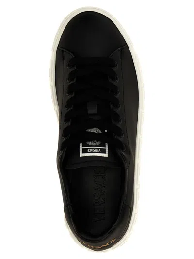 Shop Versace 'greca' Sneakers In White/black