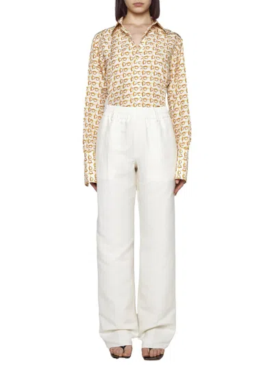 Shop Burberry Trousers In White