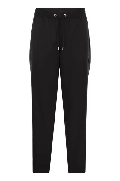 Shop Moncler Wool Gabardine Joggers In Black