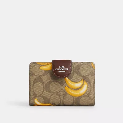 Shop Coach Outlet Medium Corner Zip Wallet In Signature Canvas With Banana Print In Multi